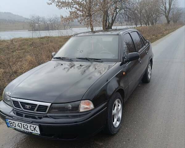 Черный Дэу Нексия, объемом двигателя 1.5 л и пробегом 150 тыс. км за 1400 $, фото 1 на Automoto.ua