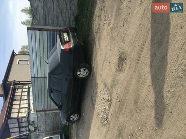 Чорний Деу Нексія, об'ємом двигуна 1.5 л та пробігом 145 тис. км за 1750 $, фото 1 на Automoto.ua