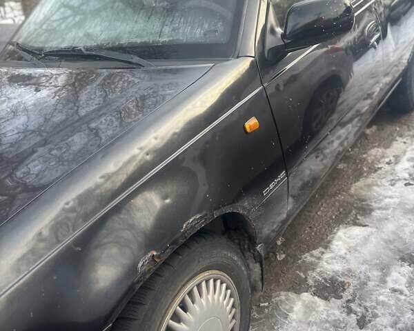 Черный Дэу Нексия, объемом двигателя 1.6 л и пробегом 166 тыс. км за 1500 $, фото 1 на Automoto.ua