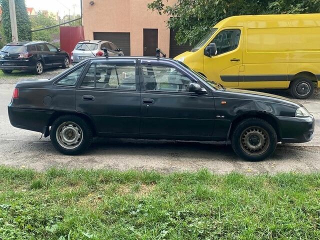 Черный Дэу Нексия, объемом двигателя 1.5 л и пробегом 210 тыс. км за 1800 $, фото 1 на Automoto.ua