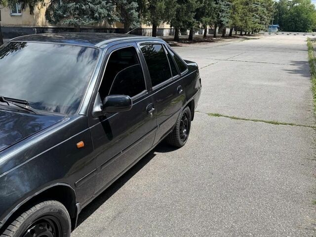 Чорний Деу Нексія, об'ємом двигуна 1.6 л та пробігом 202 тис. км за 2150 $, фото 1 на Automoto.ua
