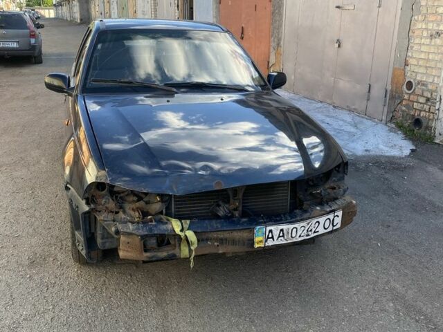 Черный Дэу Нексия, объемом двигателя 1.6 л и пробегом 250 тыс. км за 600 $, фото 1 на Automoto.ua