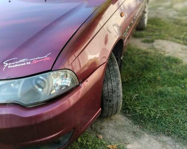 Червоний Деу Нексія, об'ємом двигуна 1.6 л та пробігом 142 тис. км за 1589 $, фото 1 на Automoto.ua