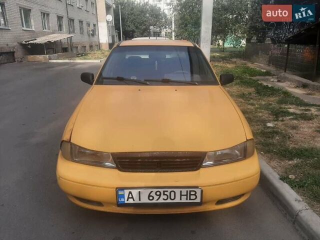 Желтый Дэу Нексия, объемом двигателя 1.5 л и пробегом 245 тыс. км за 1200 $, фото 1 на Automoto.ua