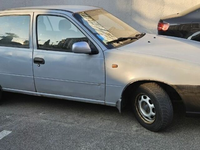 Сірий Деу Нексія, об'ємом двигуна 1.5 л та пробігом 252 тис. км за 1558 $, фото 1 на Automoto.ua