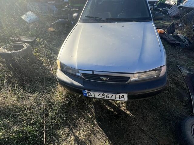 Сірий Деу Нексія, об'ємом двигуна 1.5 л та пробігом 77 тис. км за 566 $, фото 1 на Automoto.ua