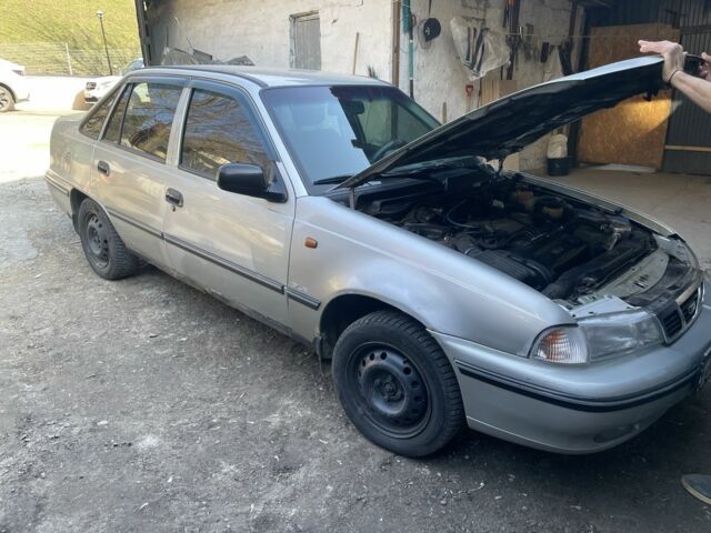 Серый Дэу Нексия, объемом двигателя 1.6 л и пробегом 245 тыс. км за 1900 $, фото 1 на Automoto.ua