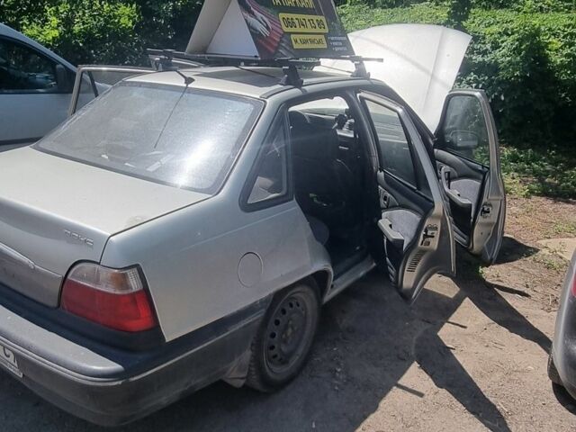 Сірий Деу Нексія, об'ємом двигуна 1.5 л та пробігом 125 тис. км за 1348 $, фото 1 на Automoto.ua