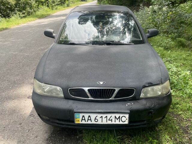 Черный Дэу Нубира, объемом двигателя 1.6 л и пробегом 235 тыс. км за 700 $, фото 1 на Automoto.ua