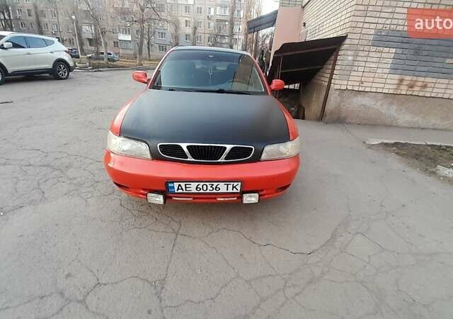 Красный Дэу Нубира, объемом двигателя 1.6 л и пробегом 333 тыс. км за 1500 $, фото 1 на Automoto.ua