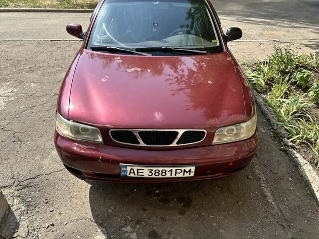 Красный Дэу Нубира, объемом двигателя 1.6 л и пробегом 284 тыс. км за 1600 $, фото 1 на Automoto.ua