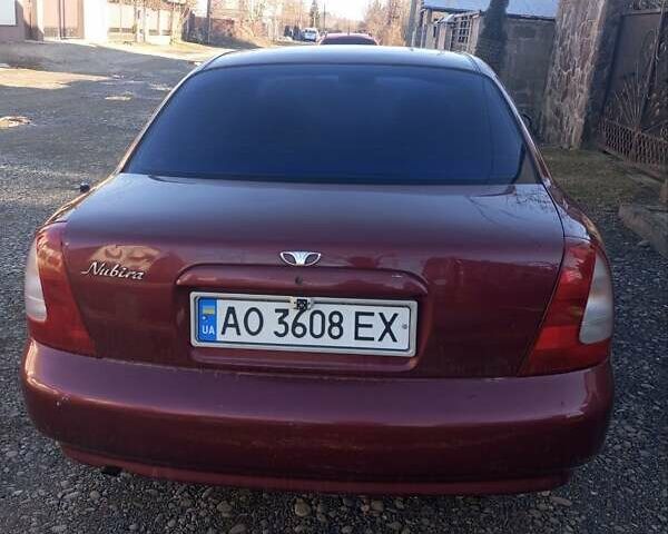 Красный Дэу Нубира, объемом двигателя 1.6 л и пробегом 250 тыс. км за 2100 $, фото 1 на Automoto.ua