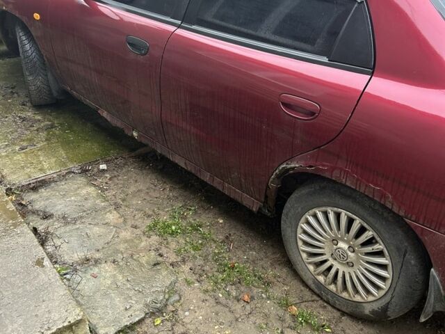 Красный Дэу Нубира, объемом двигателя 1.6 л и пробегом 230 тыс. км за 1400 $, фото 1 на Automoto.ua