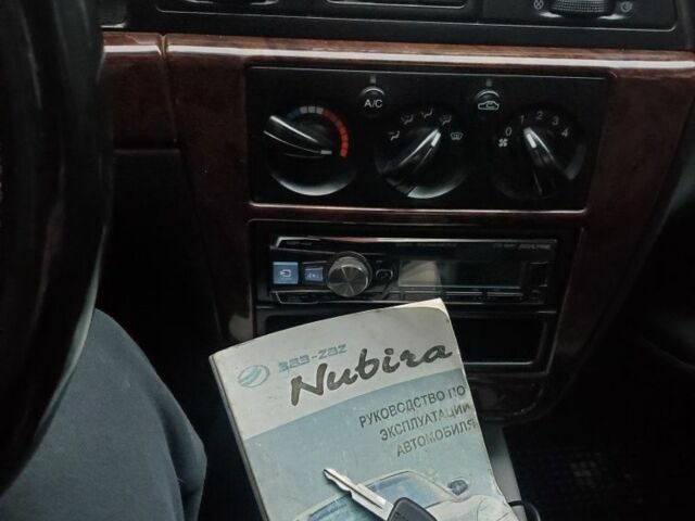 Красный Дэу Нубира, объемом двигателя 2 л и пробегом 300 тыс. км за 2300 $, фото 1 на Automoto.ua