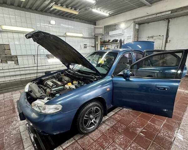 Синий Дэу Нубира, объемом двигателя 1.6 л и пробегом 268 тыс. км за 2400 $, фото 1 на Automoto.ua