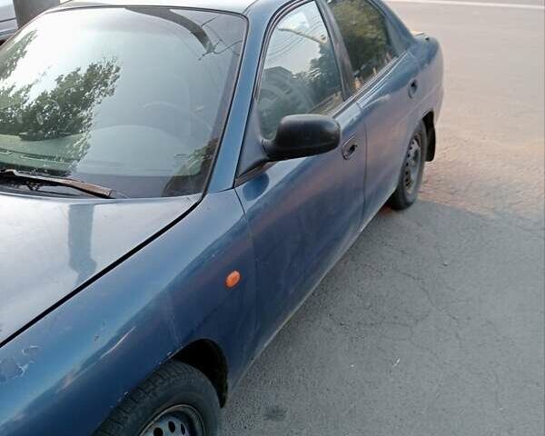 Синій Деу Нубіра, об'ємом двигуна 1.6 л та пробігом 275 тис. км за 1399 $, фото 1 на Automoto.ua