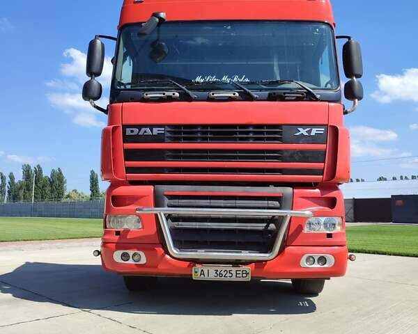 Красный Даф XF 105, объемом двигателя 12.9 л и пробегом 999 тыс. км за 15000 $, фото 1 на Automoto.ua