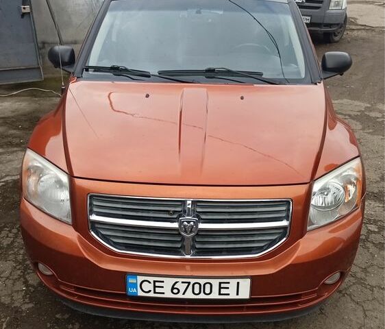 Оранжевый Додж Калибер, объемом двигателя 2 л и пробегом 300 тыс. км за 6800 $, фото 1 на Automoto.ua