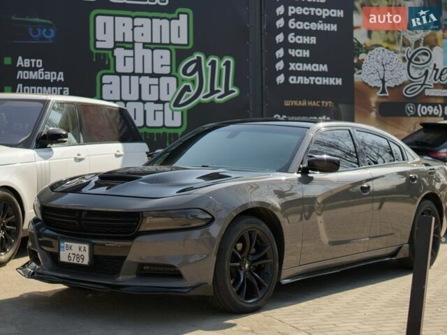 Серый Додж Чарджер, объемом двигателя 3.6 л и пробегом 156 тыс. км за 19500 $, фото 1 на Automoto.ua