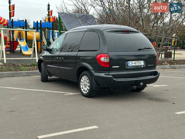 Черный Додж Рам Ван, объемом двигателя 2.5 л и пробегом 200 тыс. км за 2999 $, фото 1 на Automoto.ua