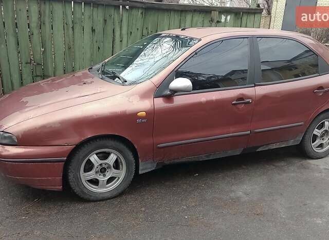 Красный Фиат Браво, объемом двигателя 1.6 л и пробегом 286 тыс. км за 750 $, фото 1 на Automoto.ua