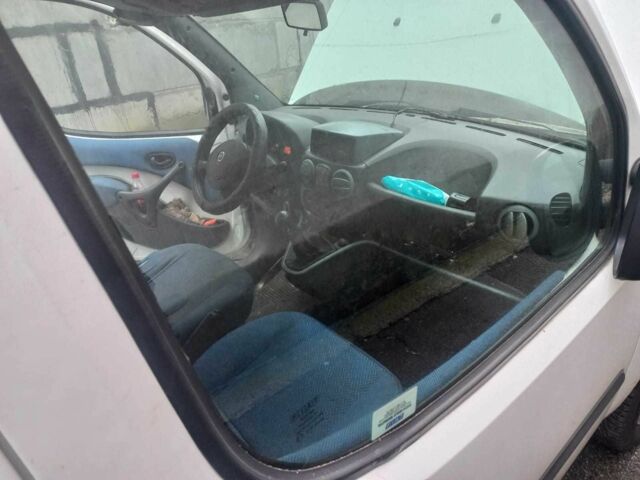 Белый Фиат Добло, объемом двигателя 1.9 л и пробегом 290 тыс. км за 3341 $, фото 1 на Automoto.ua