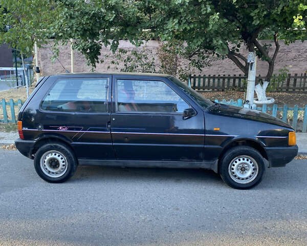 Чорний Фіат Уно, об'ємом двигуна 1 л та пробігом 200 тис. км за 950 $, фото 1 на Automoto.ua