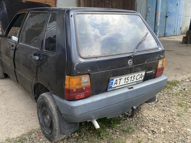 Черный Фиат Уно, объемом двигателя 1.5 л и пробегом 90 тыс. км за 300 $, фото 1 на Automoto.ua