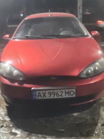 Красный Форд Кугар, объемом двигателя 2 л и пробегом 312 тыс. км за 4400 $, фото 1 на Automoto.ua