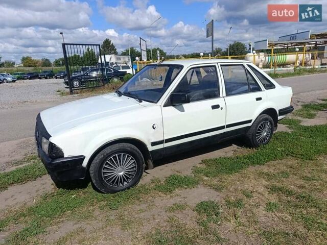 Белый Форд Эскорт, объемом двигателя 1.4 л и пробегом 286 тыс. км за 750 $, фото 1 на Automoto.ua