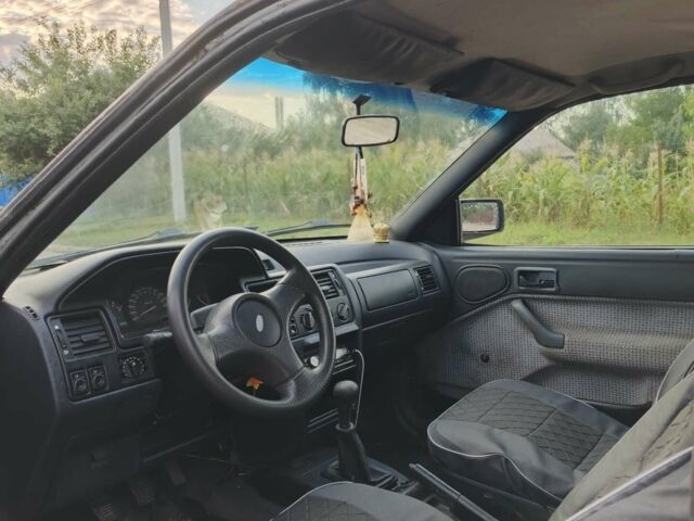 Белый Форд Эскорт, объемом двигателя 1.3 л и пробегом 400 тыс. км за 446 $, фото 1 на Automoto.ua
