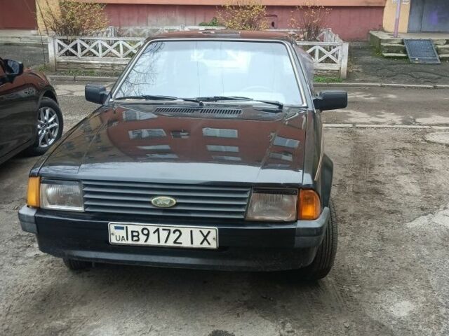 Черный Форд Эскорт, объемом двигателя 1.3 л и пробегом 200 тыс. км за 593 $, фото 1 на Automoto.ua