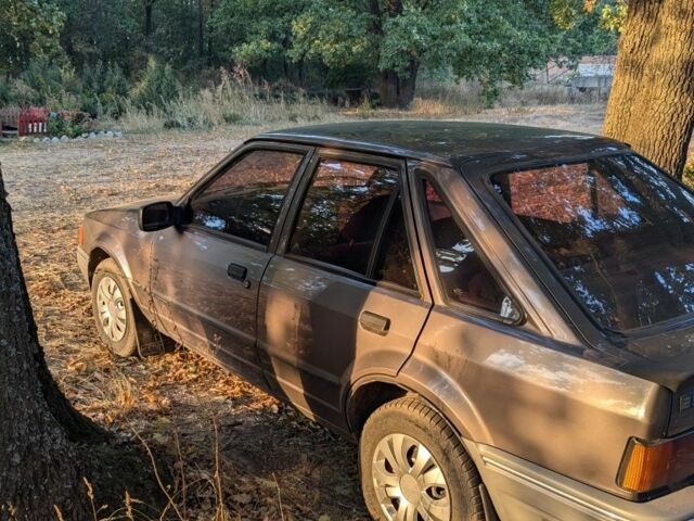 Коричневый Форд Эскорт, объемом двигателя 1.4 л и пробегом 100 тыс. км за 800 $, фото 1 на Automoto.ua