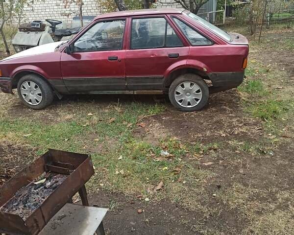 Красный Форд Эскорт, объемом двигателя 1.4 л и пробегом 500 тыс. км за 400 $, фото 1 на Automoto.ua