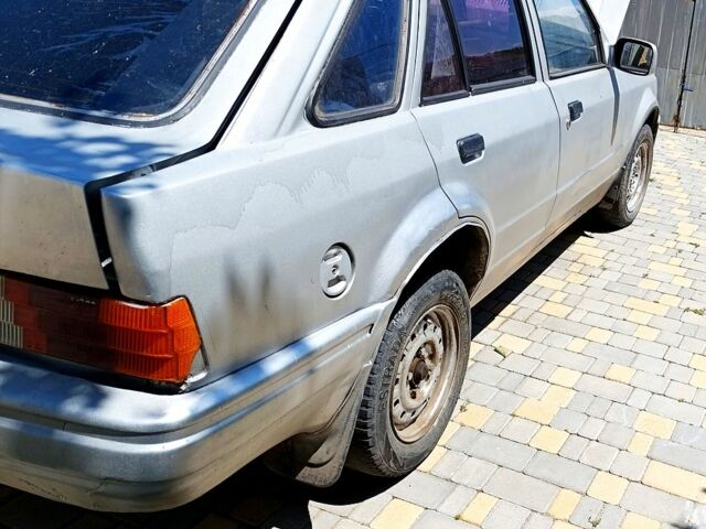 Серый Форд Эскорт, объемом двигателя 1.6 л и пробегом 100 тыс. км за 600 $, фото 1 на Automoto.ua