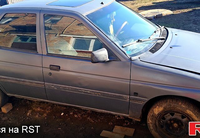 Серый Форд Эскорт, объемом двигателя 1.4 л и пробегом 300 тыс. км за 460 $, фото 1 на Automoto.ua