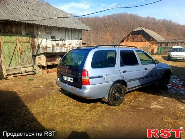 Серый Форд Эскорт, объемом двигателя 1.4 л и пробегом 250 тыс. км за 750 $, фото 1 на Automoto.ua