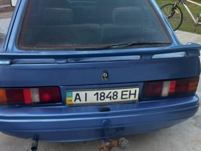 Синій Форд Ескорт, об'ємом двигуна 1.4 л та пробігом 200 тис. км за 1400 $, фото 1 на Automoto.ua