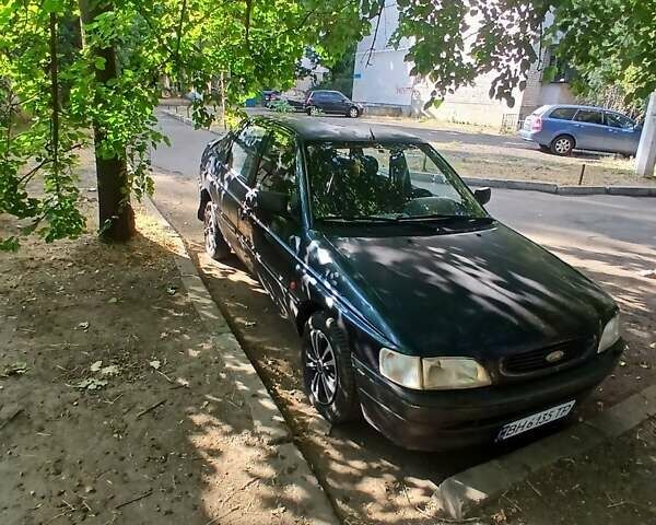 Синий Форд Эскорт, объемом двигателя 1.4 л и пробегом 100 тыс. км за 1300 $, фото 1 на Automoto.ua