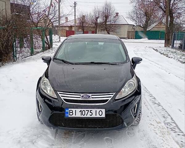 Черный Форд Фиеста, объемом двигателя 1.6 л и пробегом 241 тыс. км за 6200 $, фото 1 на Automoto.ua