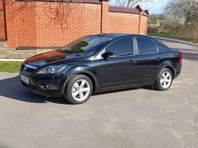 Черный Форд Фокус, объемом двигателя 1.6 л и пробегом 300 тыс. км за 4650 $, фото 1 на Automoto.ua