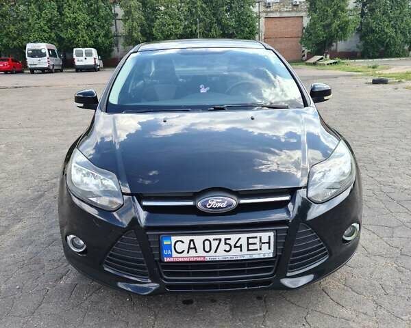 Черный Форд Фокус, объемом двигателя 1.6 л и пробегом 129 тыс. км за 6850 $, фото 1 на Automoto.ua
