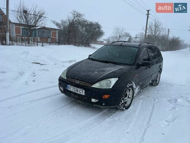 Черный Форд Фокус, объемом двигателя 1.8 л и пробегом 222 тыс. км за 2000 $, фото 1 на Automoto.ua
