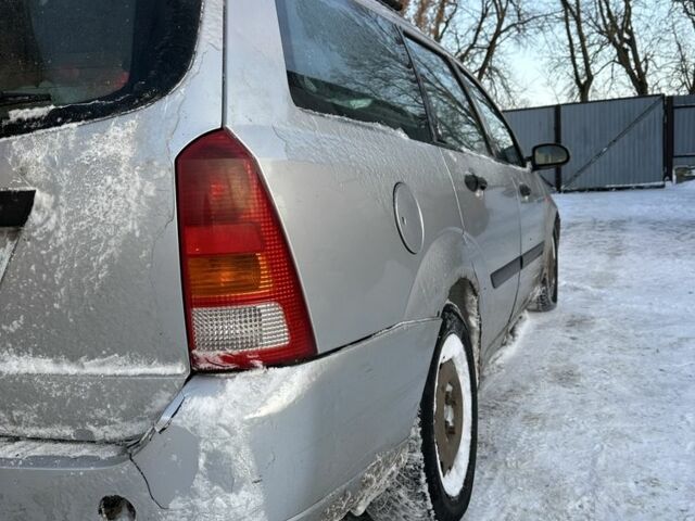 Серый Форд Фокус, объемом двигателя 1.8 л и пробегом 302 тыс. км за 1650 $, фото 1 на Automoto.ua