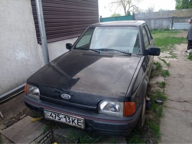 Черный Форд Орион, объемом двигателя 1.4 л и пробегом 200 тыс. км за 900 $, фото 1 на Automoto.ua