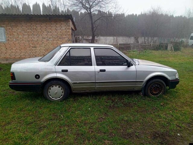 Серый Форд Орион, объемом двигателя 1.3 л и пробегом 300 тыс. км за 300 $, фото 1 на Automoto.ua