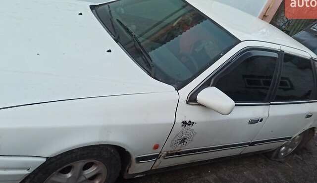 Белый Форд Скорпио, объемом двигателя 2 л и пробегом 400 тыс. км за 790 $, фото 1 на Automoto.ua