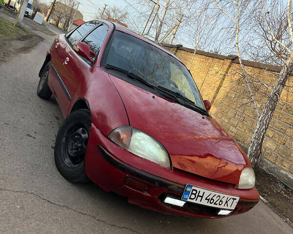 Червоний Гео Метро, об'ємом двигуна 1.32 л та пробігом 200 тис. км за 1350 $, фото 1 на Automoto.ua