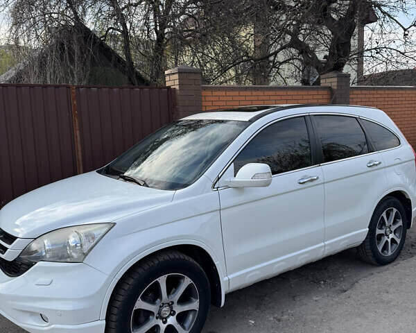 Белый Хонда СРВ, объемом двигателя 2.4 л и пробегом 176 тыс. км за 12900 $, фото 1 на Automoto.ua