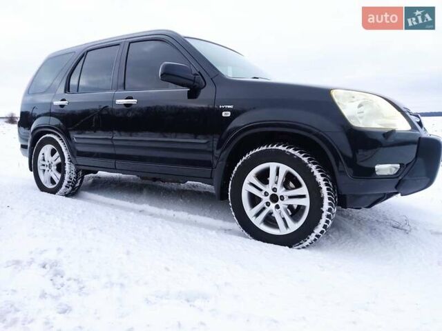 Черный Хонда СРВ, объемом двигателя 2 л и пробегом 255 тыс. км за 7300 $, фото 1 на Automoto.ua
